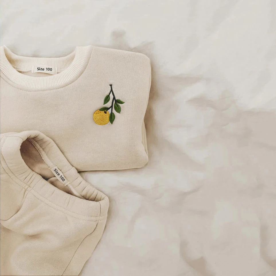 Cream coloured lemon embroidered tracksuit for babies and toddlers
